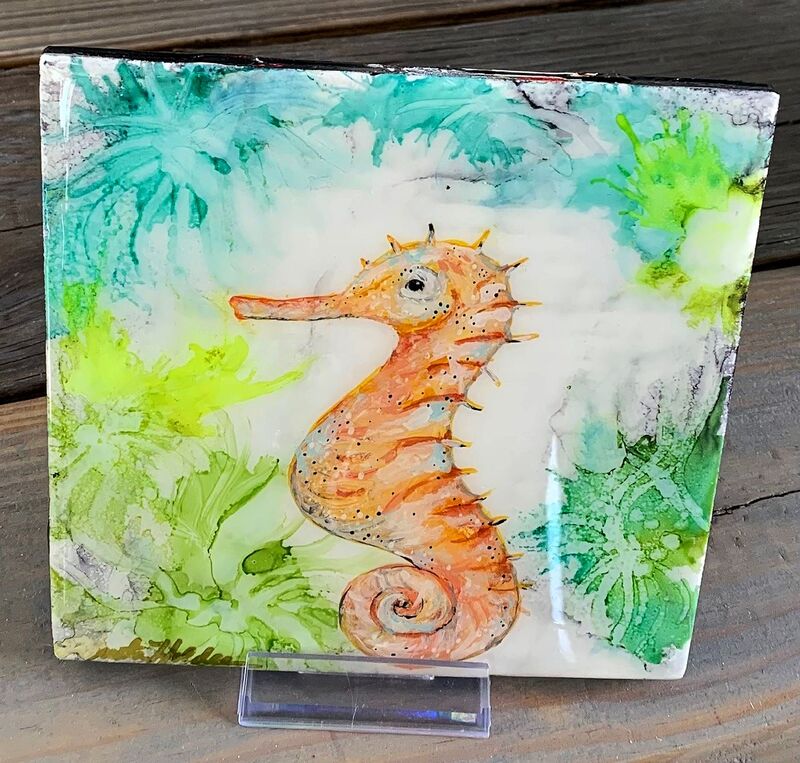 Alcohol ink tile with painted seahorse.