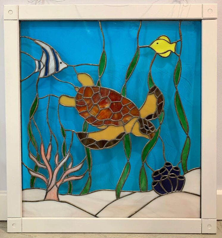 Underwater scene stained glass with turtle and fish.