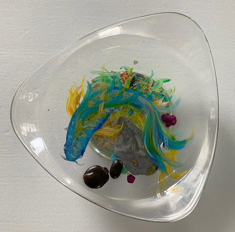 Clear glass bowl with resin and koi fish art.