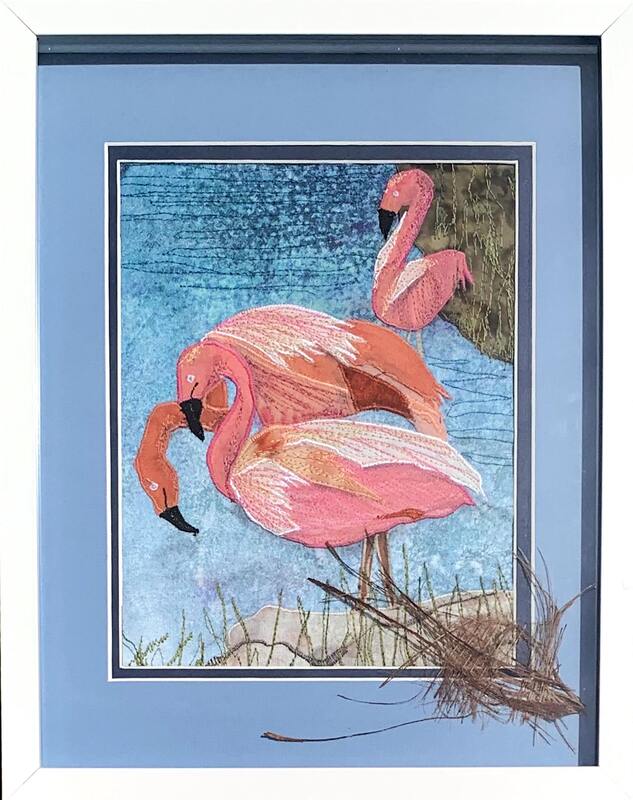Three flamingos textile artwork.