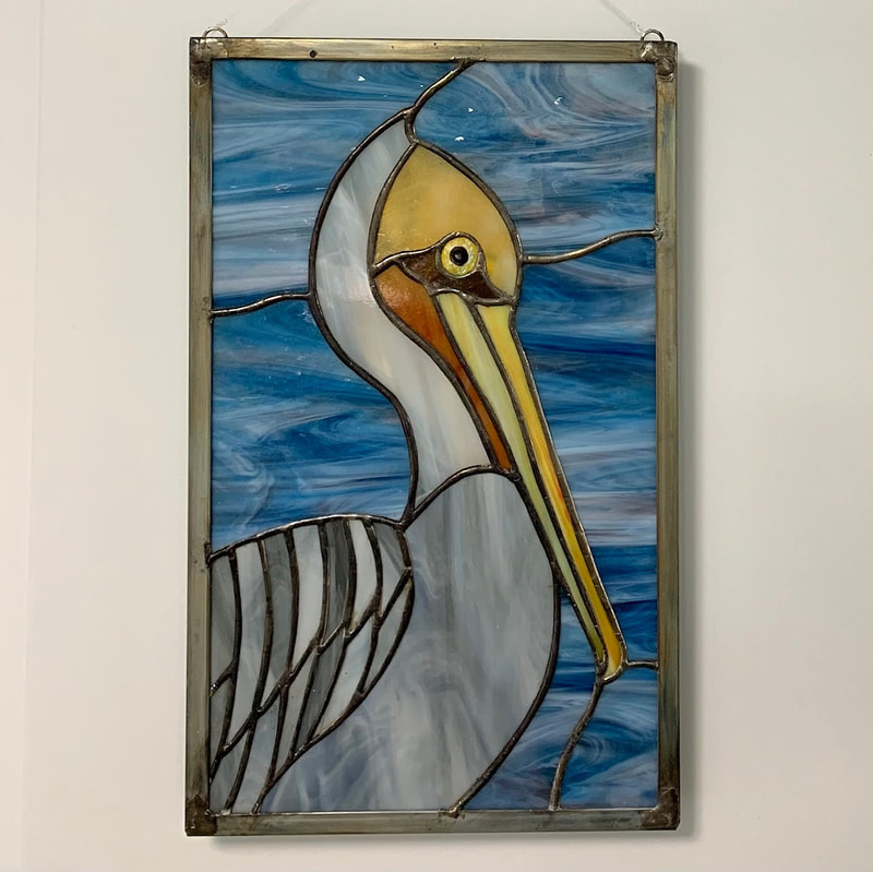 Beautiful pelican stained glass for window.