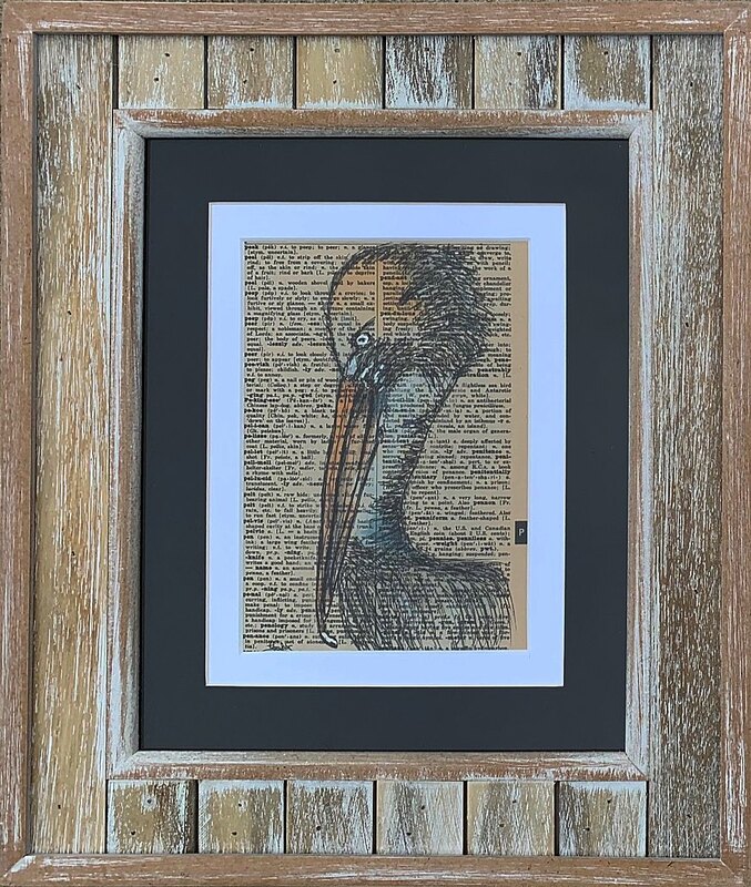Pelican art in a wooden frame.