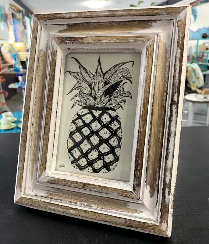 Framed pineapple drawing.