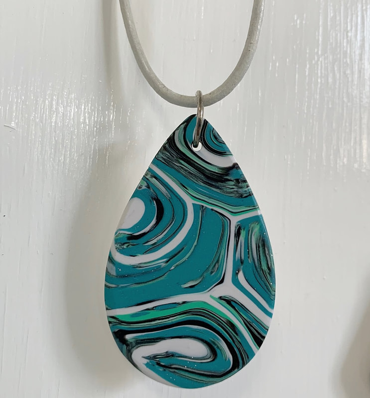 Handcrafted necklace from polymer clay.