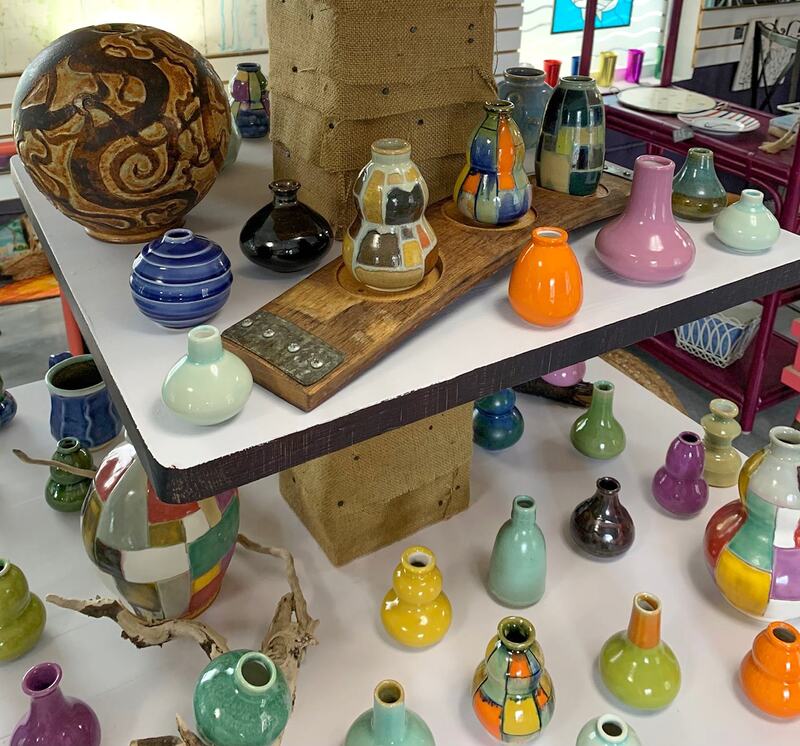 Handmade miniature pottery vases in all colors.