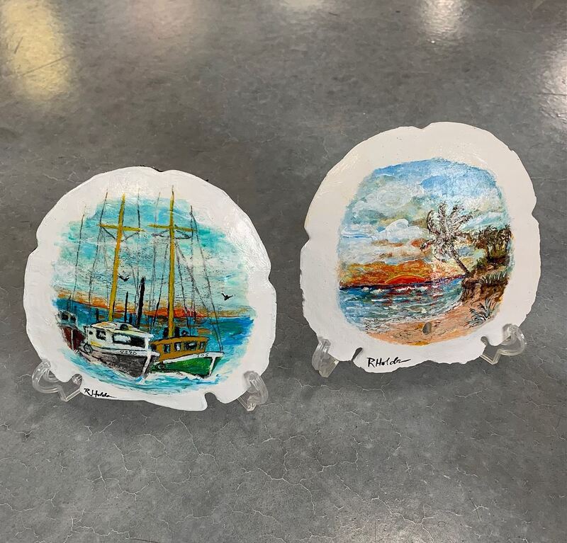 Sailboat painting and palm tree beach painting on seashells.