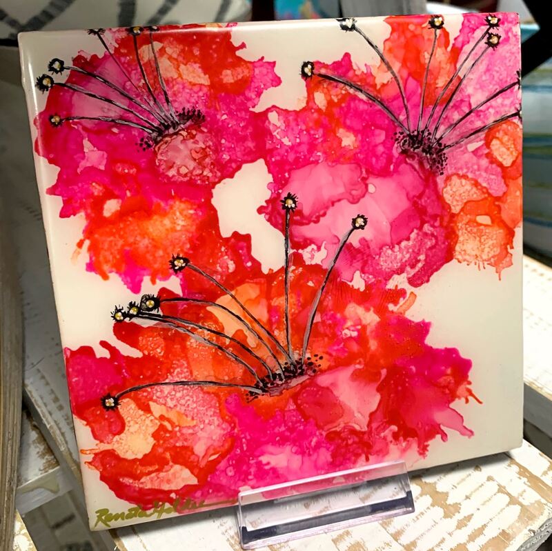 Pink and orange flower painted tile.